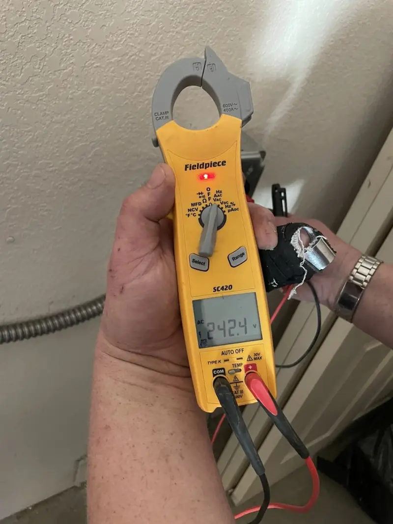 Voltage testing with clamp meter during Hot Tub / Pool Electrical Wiring in Big Lake